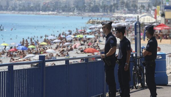 French police officers patrol on the famed Promenade des Anglais in Nice, southern France, three days after a truck mowed through revelers, Sunday, July 17, 2016. - Sputnik International