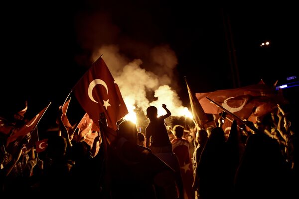 Pro-Erdogan supporters wave Turkish national flags during a rally at Taksim square in Istanbul on July 18, 2016 following the military failed coup attempt of July 15 Pro-Erdogan supporters wave Turkish national flags during a rally at Taksim square in Istanbul on July 18, 2016 following the military failed coup attempt of July 15 - Sputnik International