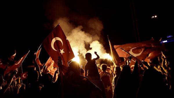 Pro-Erdogan supporters wave Turkish national flags during a rally at Taksim square in Istanbul on July 18, 2016 following the military failed coup attempt of July 15 - Sputnik International