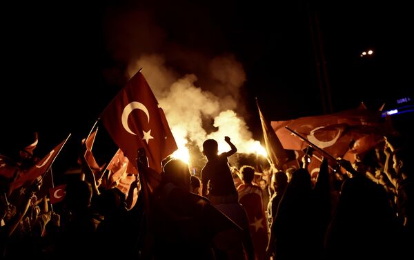 Pro-Erdogan supporters wave Turkish national flags during a rally at Taksim square in Istanbul on July 18, 2016 following the military failed coup attempt of July 15 - Sputnik International