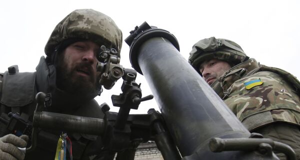 Ukrainian servicemen aim a mortar from their position near the eastern Ukrainian village Pisky, Donetsk region. File photo Ukrainian servicemen aim a mortar from their position near the eastern Ukrainian village Pisky, Donetsk region. File photo - Sputnik International