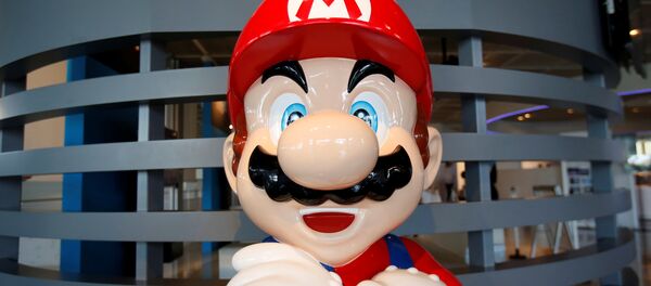 A figure depicting Mario, a character in Nintendo's Mario Bros. video games, is displayed at the company showroom in Tokyo, Japan July 14, 2016. - Sputnik International