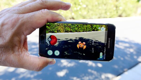 The augmented reality mobile game Pokemon Go by Nintendo is shown on a smartphone screen in this photo illustration taken in Palm Springs, California U.S. July 11, 2016 - Sputnik International