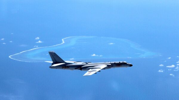 In this undated photo released by Xinhua News Agency, a Chinese H-6K bomber patrols the islands and reefs in the South China Sea. - Sputnik International