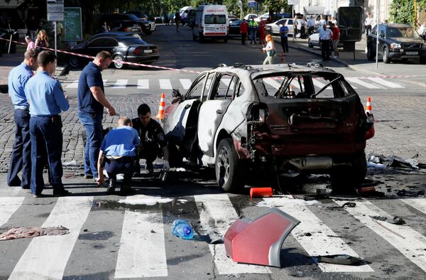 Investigators at the site where journalist Pavel Sheremet was killed by a car bomb in central Kiev, Ukraine, July 20, 2016 Investigators at the site where journalist Pavel Sheremet was killed by a car bomb in central Kiev, Ukraine, July 20, 2016 - Sputnik International