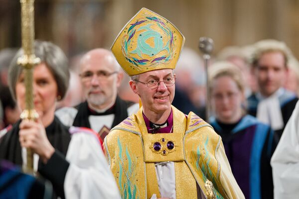 The Archbishop of Canterbury, Justin Welby (C) walks in procession after being Enthroned in Canterbury Cathedral in Canterbury on March 21, 2013. - Sputnik International