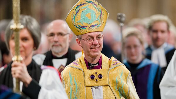 The Archbishop of Canterbury, Justin Welby (C) walks in procession after being Enthroned in Canterbury Cathedral in Canterbury on March 21, 2013. - Sputnik International