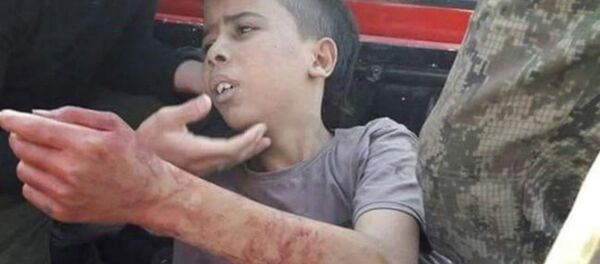 Syrian rebel group had decapitated a 12-year-old Palestinian kid - Sputnik International