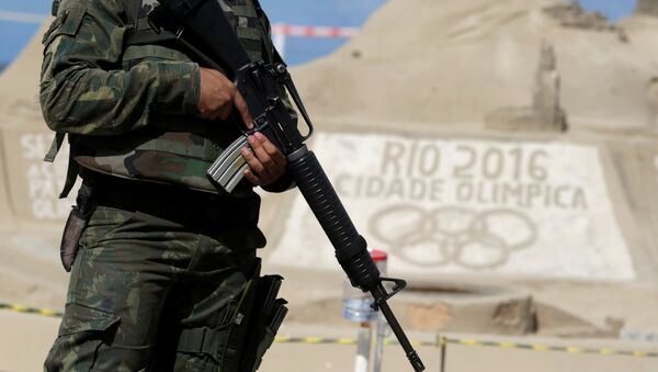 A Brazilian Army Forces soldier patrols on Copacabana beach ahead of the 2016 Rio Olympic games in Rio de Janeiro, Brazil, July 18, 2016 - Sputnik International