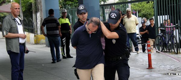 Police officers escort admiral Atilla Demirhan, front, and a group of millitary personal detained in Mersin, Turkey, Tuesday, July 19, 2016 - Sputnik International