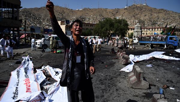 An Afghan protester screams near the scene of a suicide attack that targeted crowds of minority Shiite Hazaras during a demonstration at the Deh Mazang Circle in Kabul on July 23, 2016. - Sputnik International