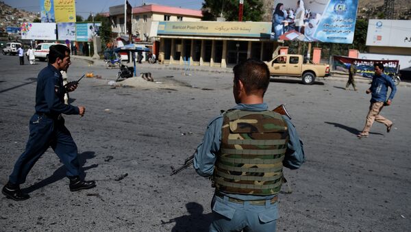 Afghan security personnel arrive after a suicide attack that targeted crowds of minority Shiite Hazaras during a demonstration at the Deh Mazang Circle of Kabul on July 23, 2016. - Sputnik International