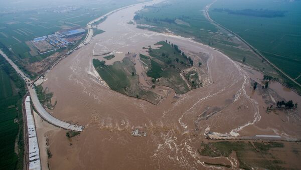 An aerial view shows that roads and fields are flooded in Xingtai, Hebei Province, China - Sputnik International