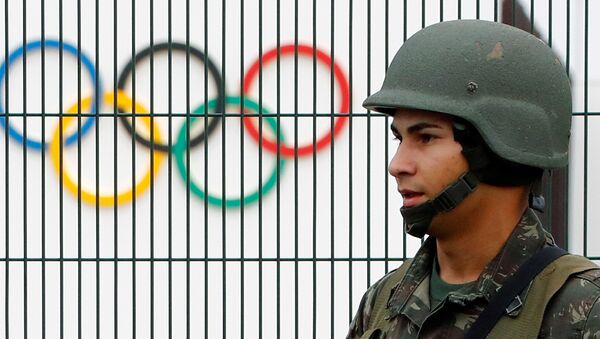 A Brazilian military police soldier patrols at the security fence outside the 2016 Rio Olympics Park in Rio de Janeiro, Brazil, July 21, 2016. - Sputnik International