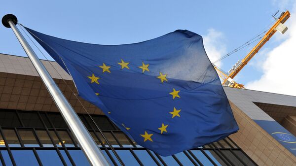 EU flag is seen in front of the EU Commission Headquarters in Brussels. (File) - Sputnik International