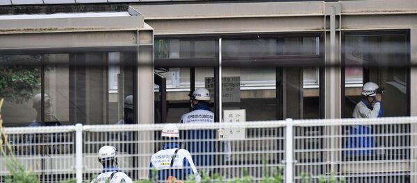Rescue workers are seen in a facility for the disabled, where a deadly attack by a knife-wielding man took place, in Sagamihara, Kanagawa prefecture, Japan, in this photo taken by Kyodo July 26, 2016. Rescue workers are seen in a facility for the disabled, where a deadly attack by a knife-wielding man took place, in Sagamihara, Kanagawa prefecture, Japan, in this photo taken by Kyodo July 26, 2016. - Sputnik International