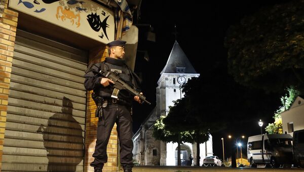 French riot police guards the street to access the church where an hostage taking left a priest dead in Saint-Etienne-du-Rouvray, Normandy, France, Tuesday, July 26, 2016 - Sputnik International