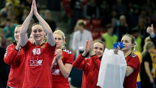 Russian players celebrate their victory in the 2016 Women's Olympic Handball Tournament qualifying match between the Russian and the Swedish national team - Sputnik International