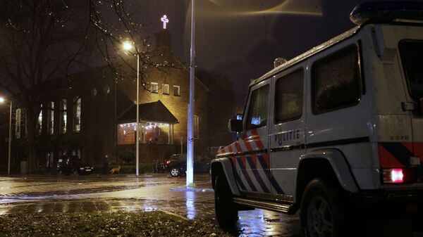 A police vehicle guards the Coptic church, rear, in Amsterdam, Netherlands (File) - Sputnik International