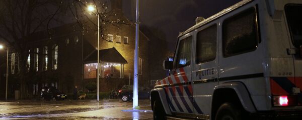 A police vehicle guards the Coptic church, rear, in Amsterdam, Netherlands (File) - Sputnik International
