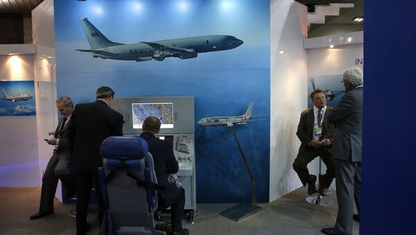 A foreign delegate sits on a mobile console for the P-81 maritime reconnaissance and anti-submarine warfare aircraft at the Boeing pavilion, during the 8th International Land and Naval Defense system exhibition, in New Delhi, India (File) - Sputnik International