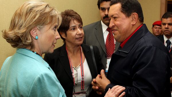 Venezuelan President Hugo Chavez listens to US Secretary of State Hilary Clinton during the Summit of the Americas in 2009 - Sputnik International
