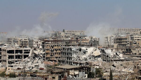 Smoke billows from buildings during an operation by Syrian government forces to retake control of the rebel-held district of Leramun, on the northwest outskirts of Aleppo, on July 26, 2016 - Sputnik International