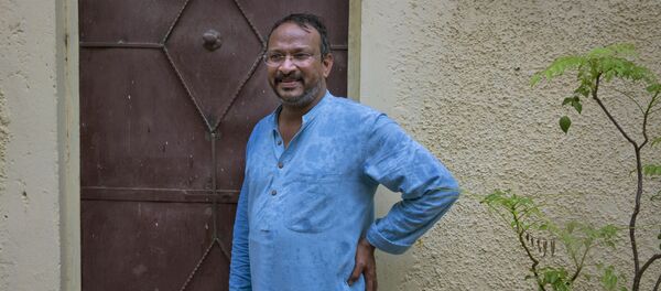 India's Bezwada Wilson, who is among the six recipients of this year's Ramon Magsaysay Award, waits to enter the Safai Karmachari Andolan (SKA) office in New Delhi, India, Wednesday, July 27, 2016 - Sputnik International