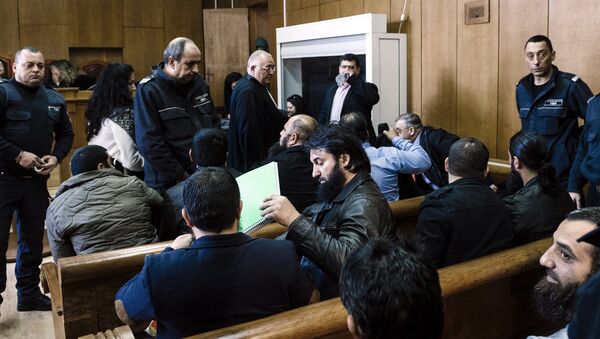 Bulgarian Roma men charged with preaching practising an ultraconservative form of Islam sit before the start of their trial at the court of Pazardzhik on February 25, 2016 - Sputnik International