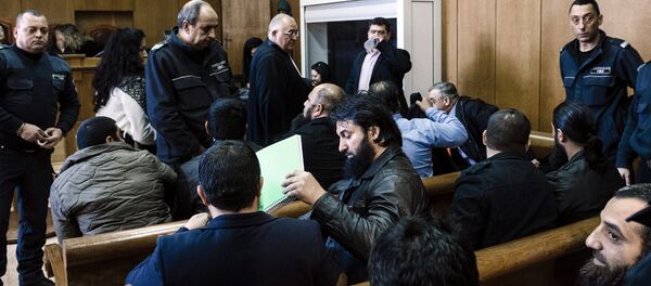 Bulgarian Roma men charged with preaching practising an ultraconservative form of Islam sit before the start of their trial at the court of Pazardzhik on February 25, 2016 - Sputnik International