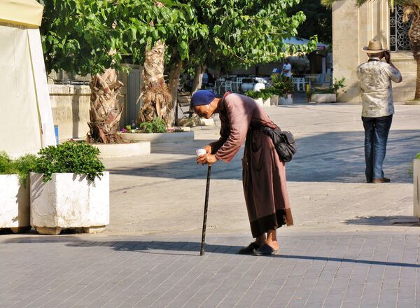 An older woman begging for money in the streets of Heraklion, Crete.  - Sputnik International
