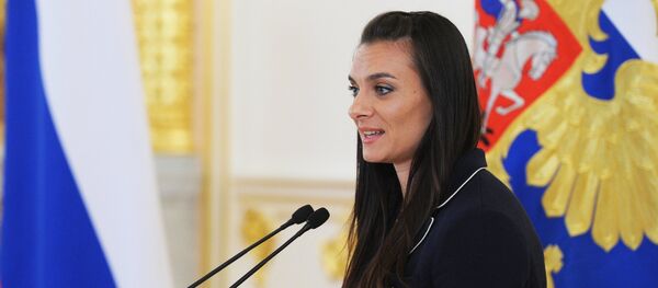 July 27, 2016. Two-time Olympic champion Yelena Isinbayeva addresses the meeting with the national Olympic team held by Russian President Vladimir Putin in the Kremlin's Alexander Hall July 27, 2016. Two-time Olympic champion Yelena Isinbayeva addresses the meeting with the national Olympic team held by Russian President Vladimir Putin in the Kremlin's Alexander Hall - Sputnik International