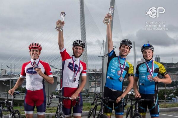 (L-R) Roman Markaryan from Russia, Mikhail Manyakhin from Russia, Martin Temmen from Germany and Matthias Fischer from Germany pose for a portrait after the 14th stage Khabarovsk-Vladivostok at the Red Bull Trans-Siberian Extreme race in Russia on July 28th, 2016 - Sputnik International