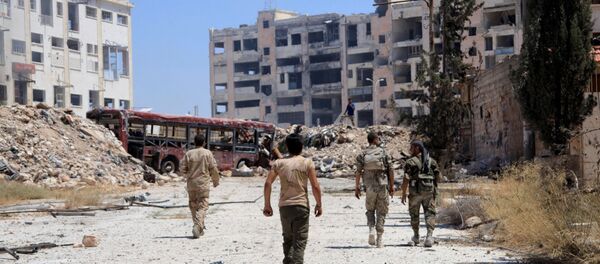Syrian army soldiers patrol the area around the entrance of Bani Zeid after taking control of the previously rebel-held district of Leramun, on the northwest outskirts of Aleppo, on July 28, 2016 Syrian army soldiers patrol the area around the entrance of Bani Zeid after taking control of the previously rebel-held district of Leramun, on the northwest outskirts of Aleppo, on July 28, 2016 - Sputnik International