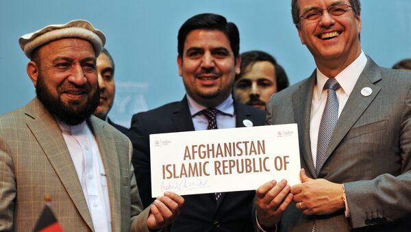 First deputy Chief Executive of the Islamic State of Afghanistan, Mohammad Khan (L) poses with World Trade Organisation (WTO) Director-General - Roberto Azevedo during a ceremony marking the accession of Afghanistan to the WTO, on December 17, 2015 in Nairobi - Sputnik International