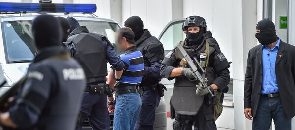 A suspected member of the Islamic State jihadist group is led away by Austrian police from the court in Linz, Austria, on July 27, 2016 A suspected member of the Islamic State jihadist group is led away by Austrian police from the court in Linz, Austria, on July 27, 2016 - Sputnik International