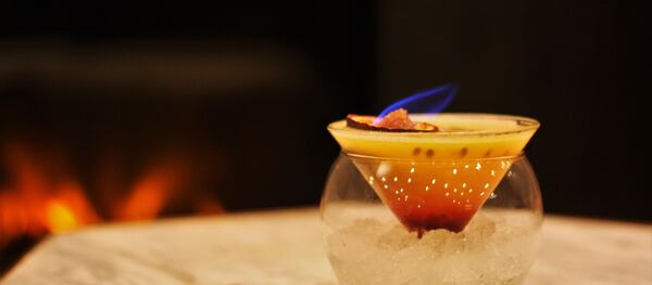 Red/Charmander: 25ml Belvedere Vodka, 45ml Passion Fruit Puree, 5ml Gomme Syrup, 10ml Grenadine. Topped with a flaming Passion Fruit. - Sputnik International