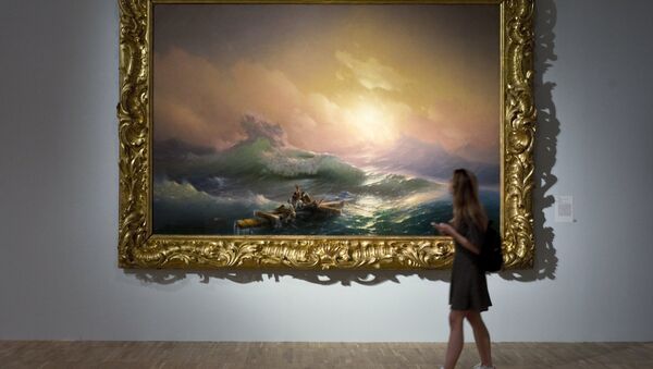 A visitor is seen near the painting The Ninth Wave displayed at the Ivan Aivazovsky. 200th Birthday exhibition at the Tretyakov Gallery on Krymsky Val in Moscow - Sputnik International