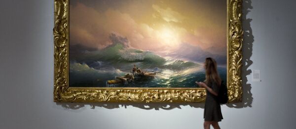 A visitor is seen near the painting The Ninth Wave displayed at the Ivan Aivazovsky. 200th Birthday exhibition at the Tretyakov Gallery on Krymsky Val in Moscow - Sputnik International