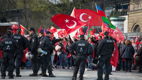 This file photo taken on April 10, 2016 shows Police cordonning protesters during a Peace March for Turkey organized by the new German Turkish Committee in Hamburg - Sputnik International
