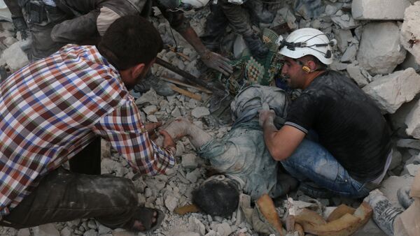 Syrian civil defence volunteers remove the body of a man from the rubble of destroyed buildings following reported airstrikes on April 27, 2016 in the rebel-held eastern neighbourhood of Bab al-Nayrab in the city of Aleppo - Sputnik International