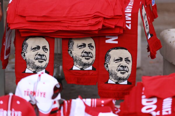 This picture taken on July 25, 2016, shows scarves with the effigy of Turkish President Recep Tayyip Erdogan a rally against the military coup in Ankara - Sputnik International