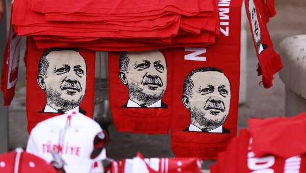 This picture taken on July 25, 2016, shows scarves with the effigy of Turkish President Recep Tayyip Erdogan a rally against the military coup in Ankara - Sputnik International