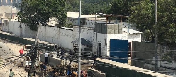 Two loud explosions with ensuing heard near the Criminal Investigation Department headquarters in Somalia's capital Mogadishu, witness reports - Sputnik International