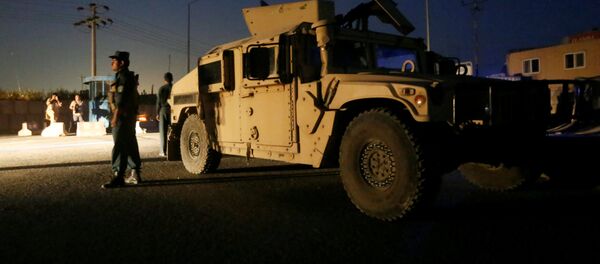 Afghan policemen keep watch near the site of a blast in Kabul, Afghanistan August 1, 2016 - Sputnik International