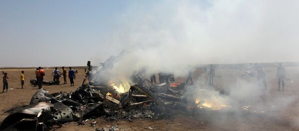 Rebel fighters and civilians inspect the wreckage of a Russian helicopter that had been shot down in the north of Syria's rebel-held Idlib province, Syria - Sputnik International