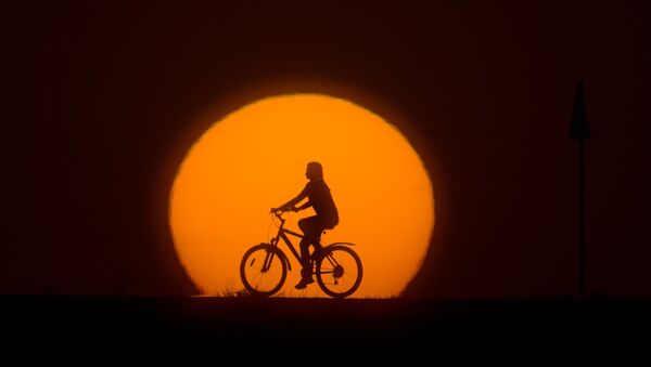 A girl riding a bike - Sputnik International