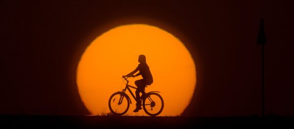 A girl riding a bike A girl riding a bike - Sputnik International