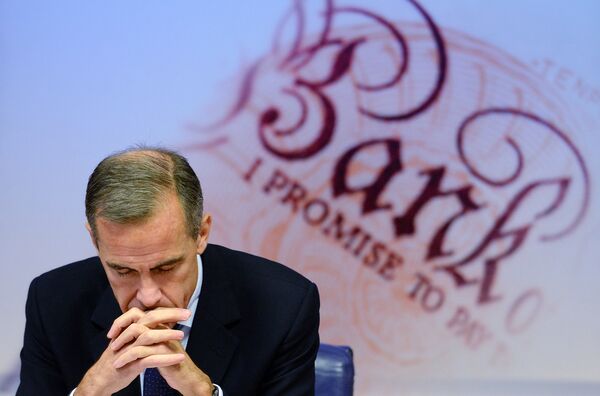 Governor of the Bank of England Mark Carney is pictured as he addresses a quarterly inflation report press conference at the Bank of England in London, on November 12, 2014. Governor of the Bank of England Mark Carney is pictured as he addresses a quarterly inflation report press conference at the Bank of England in London, on November 12, 2014. - Sputnik International