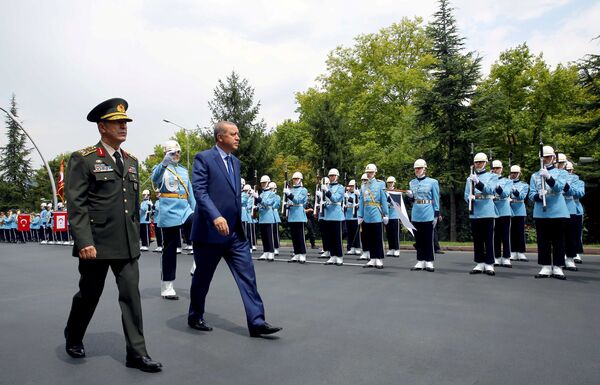 Turkey's President Tayyip Erdogan reviews a guard of honour as he is accompanied by Chief of Staff General Hulusi Akar upon his arrival to the Chief of Staff Headquarters in Ankara, Turkey, August 3, 2016. Turkey's President Tayyip Erdogan reviews a guard of honour as he is accompanied by Chief of Staff General Hulusi Akar upon his arrival to the Chief of Staff Headquarters in Ankara, Turkey, August 3, 2016. - Sputnik International